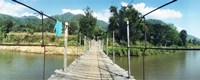 Old wooden bridge across the river, Chiang Mai Province, Thailand Fine Art Print
