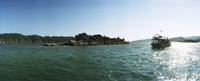 Rocky island and boat in the Mediterranean sea, Sunken City, Kekova, Antalya Province, Turkey Fine Art Print