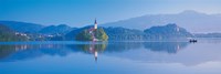 Reflection of mountains and buildings in water, Lake Bled, Slovenia Fine Art Print