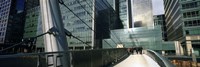 Bridge in front of buildings, Canary Wharf, London, England Fine Art Print