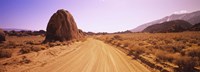 Dirt road passing through an arid landscape, Californian Sierra Nevada, California, USA Fine Art Print
