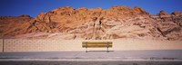 Bench in front of rocks, Red Rock Canyon State Park, Nevada, USA Fine Art Print