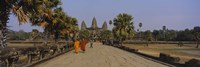 Two monks walking in front of an old temple, Angkor Wat, Siem Reap, Cambodia Fine Art Print