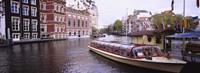 Tourboat in a channel, Amsterdam, Netherlands Fine Art Print