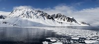 Ice floes on water with a mountain range in the background, Magdalene Fjord, Spitsbergen, Svalbard Islands, Norway Fine Art Print