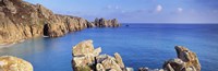 Rock formations at seaside, Logan rock, Porthcurno Bay, Cornwall, England Fine Art Print