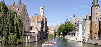 Tourboat in a canal, Bruges, West Flanders, Belgium Fine Art Print