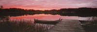 Canoe tied to dock on a small lake at sunset, Sweden Fine Art Print