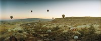 Hot air balloons over a valley, Cappadocia, Central Anatolia Region, Turkey Fine Art Print