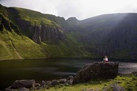 Young Woman Meditating, Coumshingaun Lough, Coeragh Mountains, County Waterford, Ireland by Panoramic Images - 24" x 16"