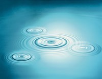 Multiple rings in blue water with bright light reflection Fine Art Print