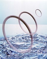 Three opaque white circles floating away from churning water Fine Art Print