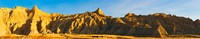 Rock formations on a landscape in golden light, Saddle Pass Trail, Badlands National Park, South Dakota, USA Fine Art Print