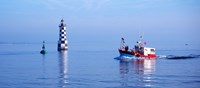 Les Perdrix lighthouse and fishing boat at Loctudy, Brittany, France Fine Art Print