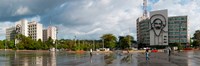 Metal sculptures of Camilo Cienfuegos and Che Guevara on two buildings, Revolutionary Square, Vedado, Havana, Cuba Fine Art Print
