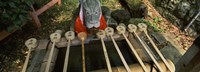 Water ladles in a shrine, Fushimi Inari-Taisha, Fushimi Ward, Kyoto, Kyoto Prefecture, Kinki Region, Honshu, Japan Fine Art Print