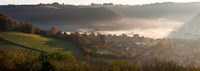 Misty morning valley with village, Uley, Gloucestershire, England Fine Art Print