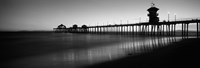 Pier in the sea, Huntington Beach Pier, Huntington Beach, Orange County, California (black and white) Framed Print