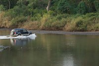 Sports utility vehicle crossing a river, Ora River, Playa Carrillo, Guanacaste, Costa Rica Fine Art Print