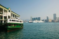 Star ferry on a pier with buildings in the background, Central District, Hong Kong Island, Hong Kong Fine Art Print