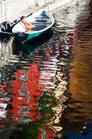 Houses and boat reflected in Lake Como, Varenna, Lombardy, Italy Fine Art Print