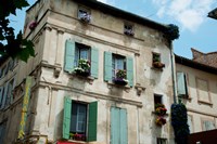 View of an old building with flower pots on each window, Rue Des Arenes, Arles, Provence-Alpes-Cote d'Azur, France Fine Art Print