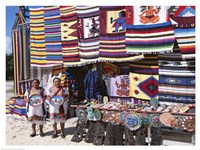 Two female vendors dressed in Mayan costumes displaying products Fine Art Print