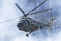 A Bulgarian Air Force Mi-17 helicopter over a forest fire in Bulgaria Fine Art Print