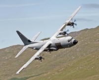 A C-130J Super Hercules low flying over North Wales on a training flight Fine Art Print