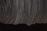 Star trails above a valley in the Firoozkooh area, Iran Fine Art Print