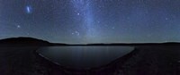 A panoramic view of the Milky Way and La Azul lagoon in Somuncura, Argentina Fine Art Print
