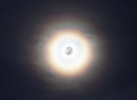 A bright halo around the full moon Fine Art Print