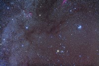 The Taurus region showing dark lanes of nebulosity Fine Art Print