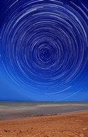 Star trails around the south celestial pole at the beach in Miramar, Argentina Fine Art Print