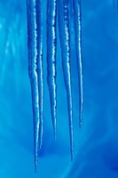 Antarctica, Icicles hanging from the roof of a glacial ice cave. Fine Art Print