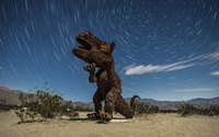 Tyrannosaurus rex sculpture against a backdrop of star trails, California Fine Art Print