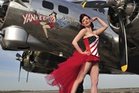 Beautiful 1940's style pin-up girl standing under a B-17 bomber by Christian Kieffer - various sizes