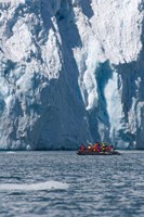 Zodiac with iceberg in the ocean, Antarctica Fine Art Print