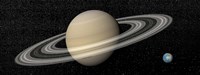 Large planet Saturn and its rings next to small planet Earth by Elena Duvernay - various sizes