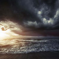 Bright sunset against a wavy sea with stormy clouds, Hersonissos, Crete Fine Art Print