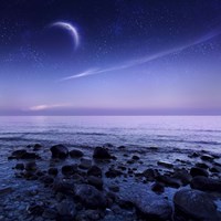 Moon rising over rocky seaside against starry sky Fine Art Print