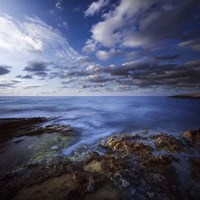 Tranquil lake and rocky shore against cloudy sky, Crete, Greece Fine Art Print