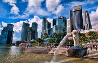 Merlion, symbol of Singapore, and downtown skyline in Fullerton area of Clarke Quay. by Bill Bachmann - various sizes
