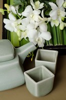 Traditional Thai tea pot and cups with orchid arrangement, Bangkok, Thailand Fine Art Print