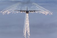 MC-130H Combat Talon Dropping Flares Framed Print