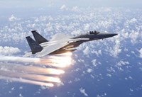 An F-15 Eagle Releases Flares over the Pacific Ocean Fine Art Print