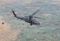 An HH-60G Pave Hawk Along the Coastline of Okinawa, Japan Fine Art Print