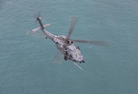 An HH-60G Pave Hawk Along the coastline of Okinawa, Japan (from above) Fine Art Print