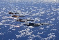 Four F-15 Eagles fly in Formation Over the Pacific Ocean Fine Art Print