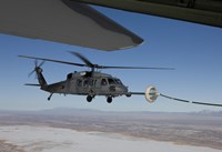 HH-60G Pave Hawk Conducts Aerial Refueling from an HC-130 Fine Art Print